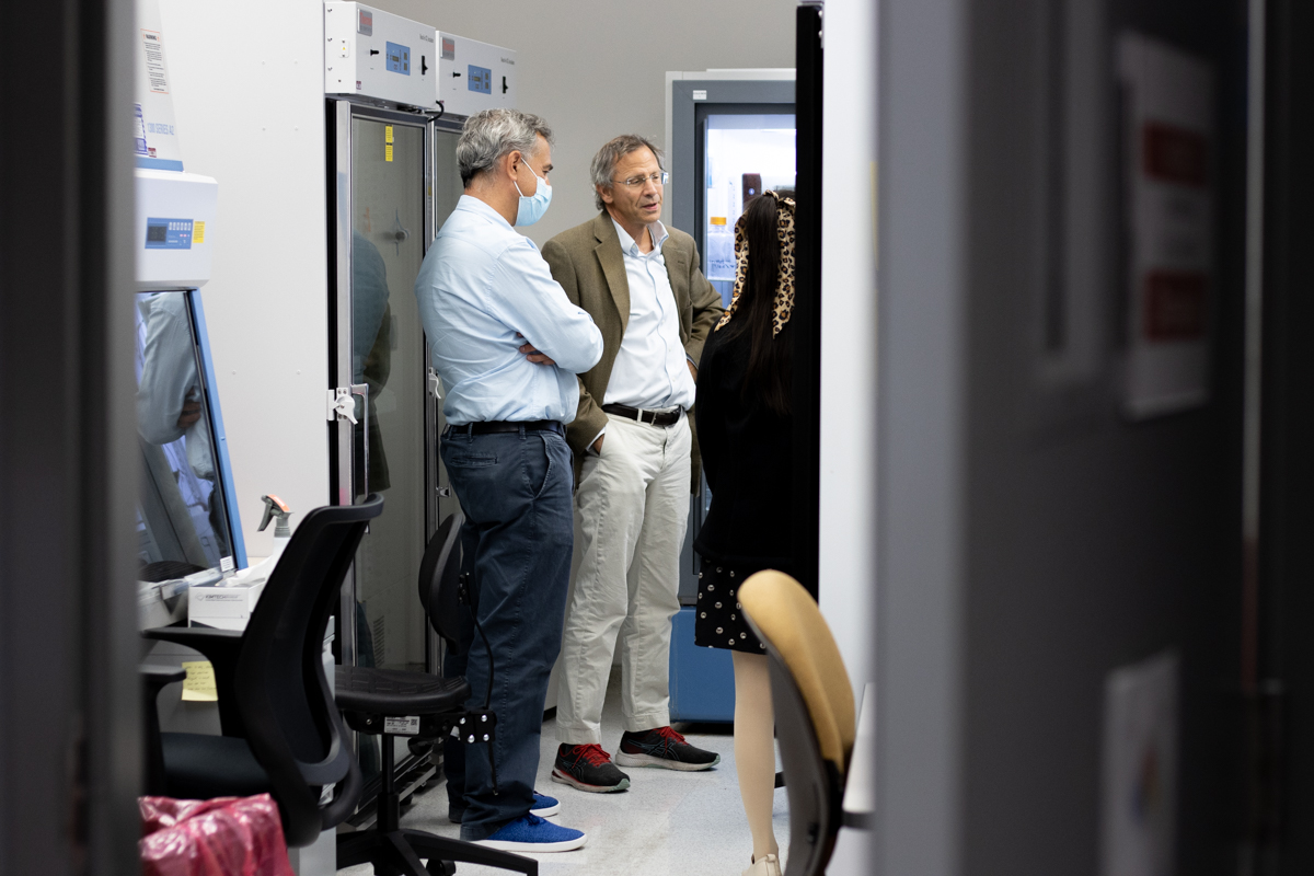 Scientists standing in protein production laboratory