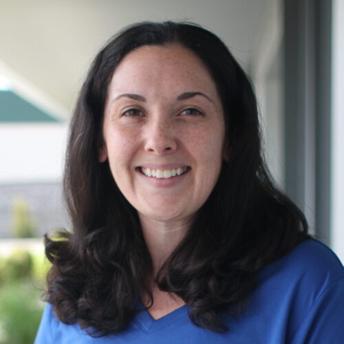 Woman smiling in Addgene t-shirt.