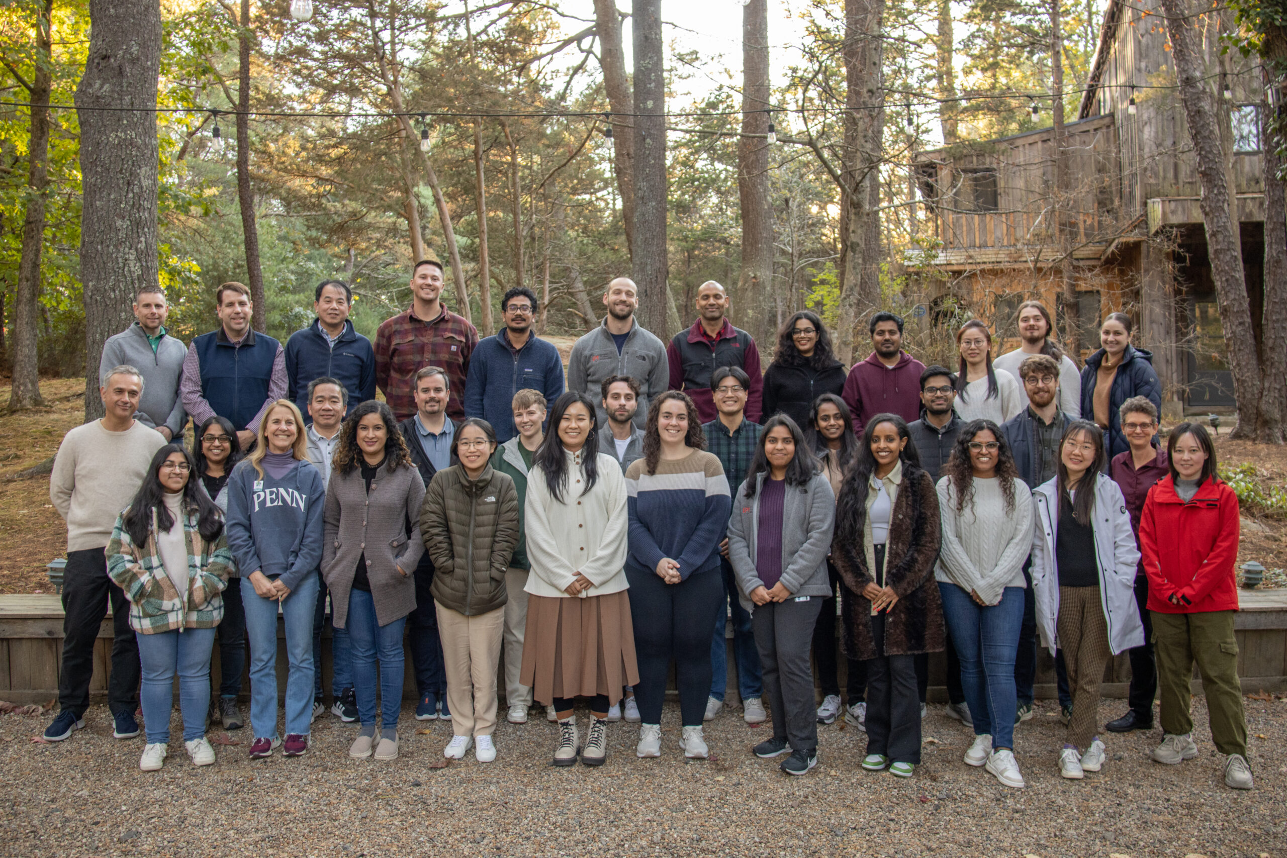 Large group of people poses for photograph.